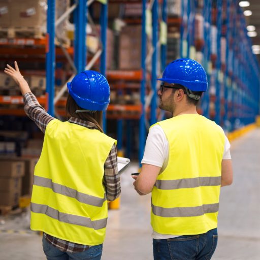 Warehouse workers sharing ideas for better organization and efficiency